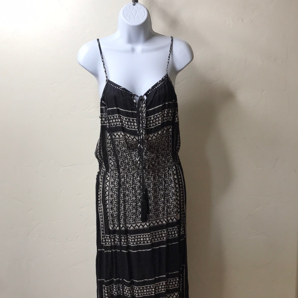 black & beige colored dress with pattern